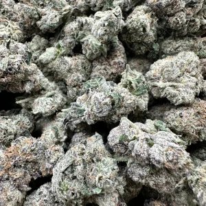 Runtz strain loud flower macro: frosted white-coated buds with dense trichome coverage and tight compact structure