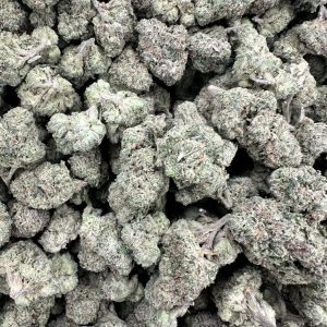 Cherry Bomb loud flower macro shot showing densely packed buds with heavy white trichome frost and tight calyx structure