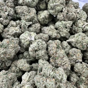 Gelonade strain loud flower macro with heavy silver-white trichome frost and dense bud structure