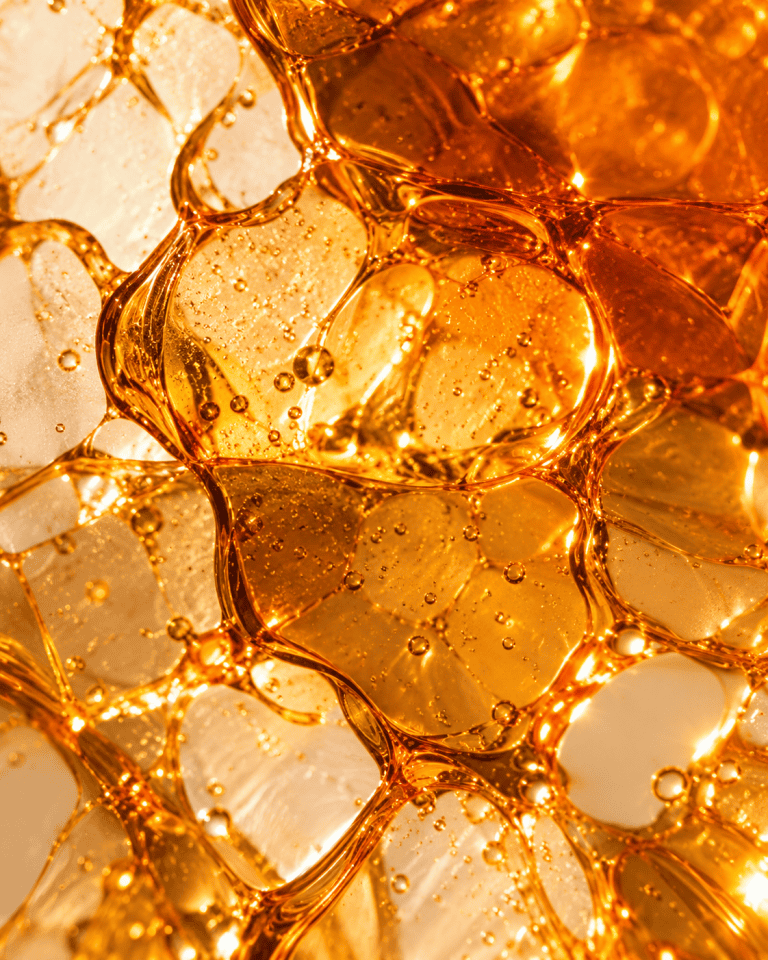 Illustrative translucent amber texture with rounded surface patterns.